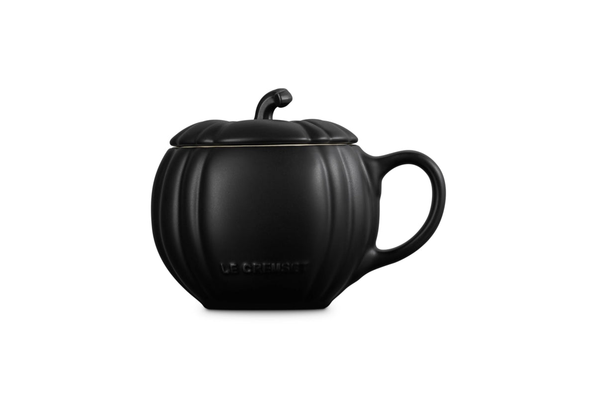 Pumpkin-shaped stoneware mug shown with lid on