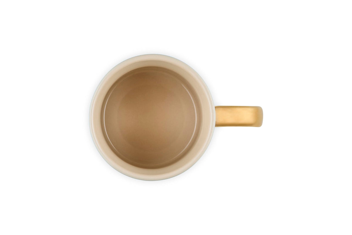 Stoneware mug showing gold-dipped handle