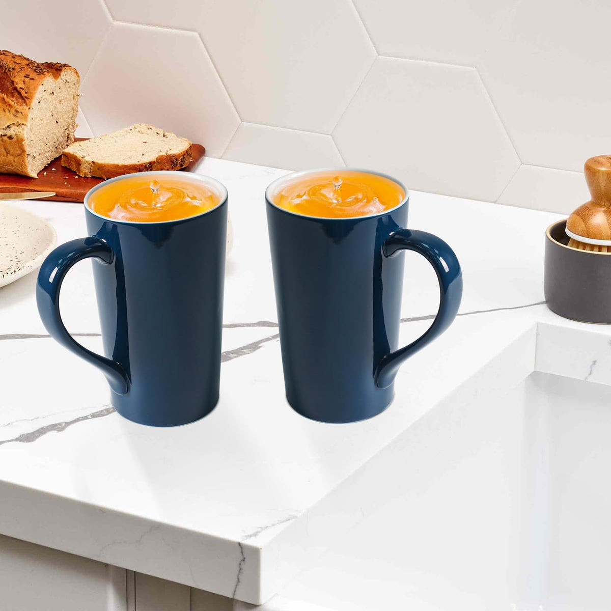 Pair of tall blue glazed coffee mugs