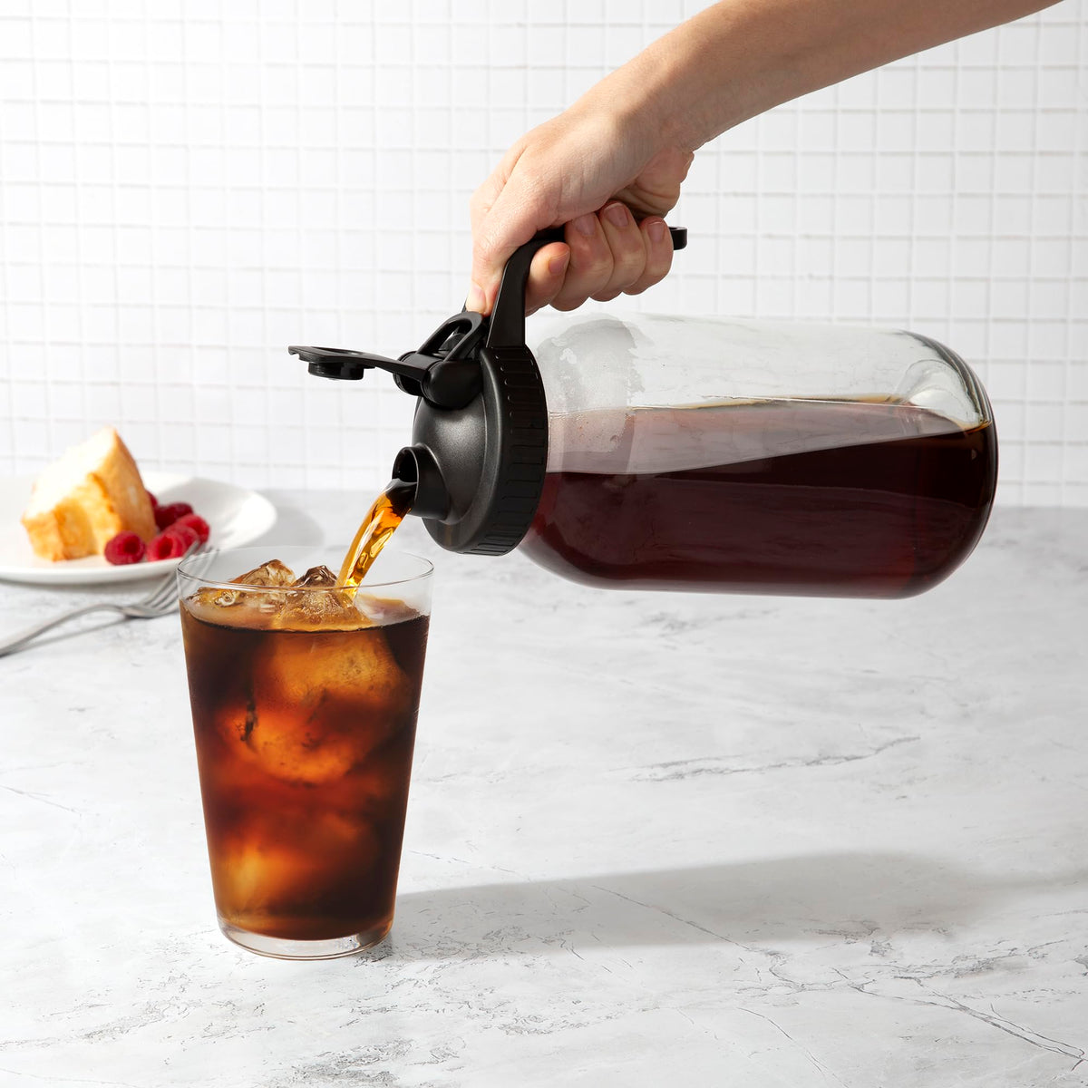 Cold brew pitcher with flip-top lid and grip handle
