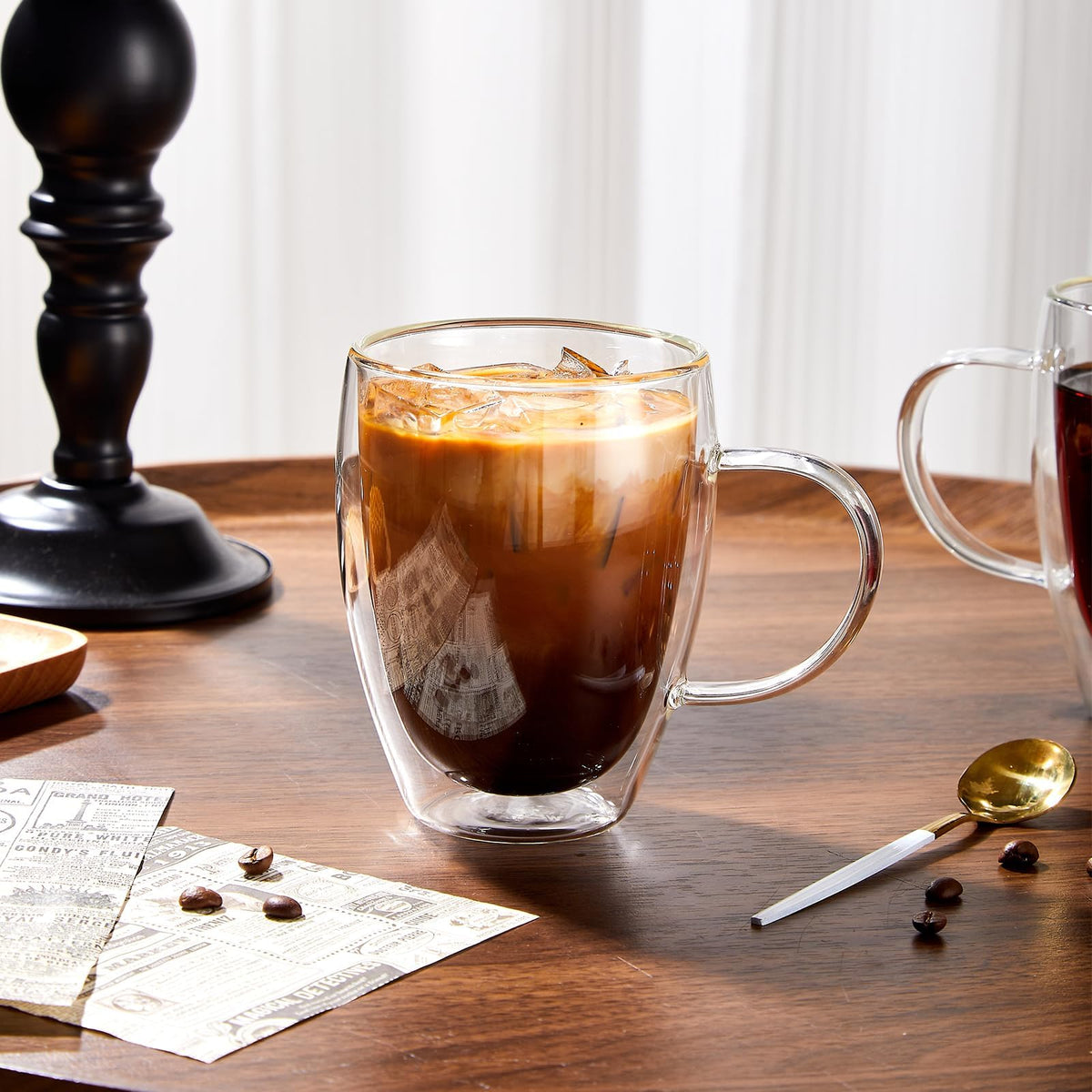 Four clear glass mugs stacked or side by side