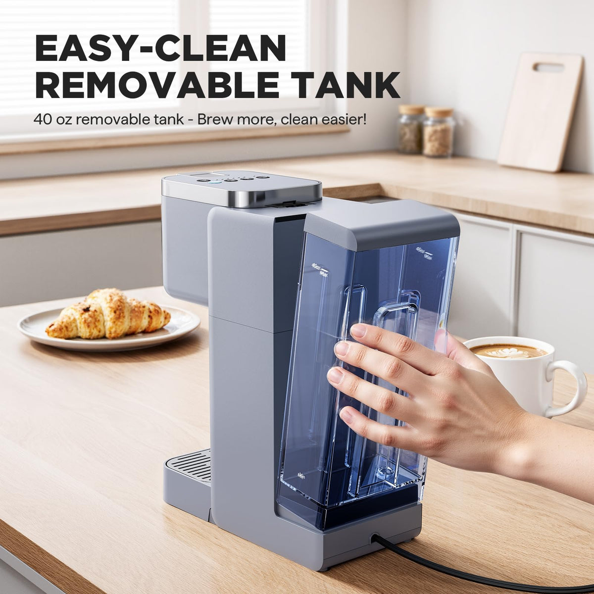 Coffee maker brewing into a travel mug-friendly space