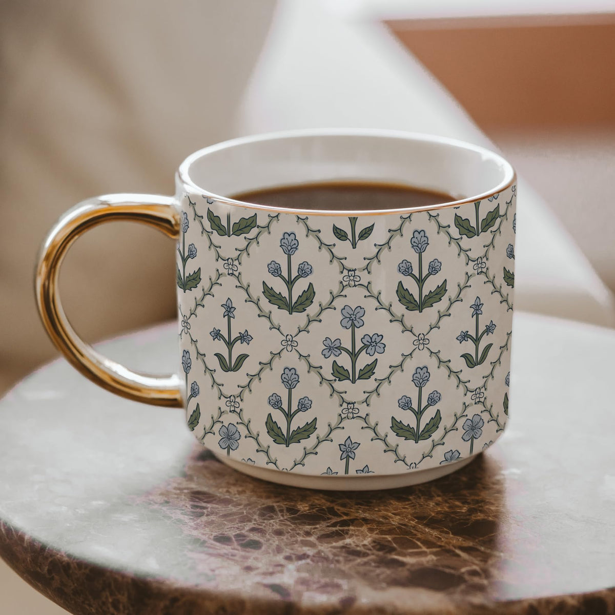 Floral coffee mug showing gold handle detail