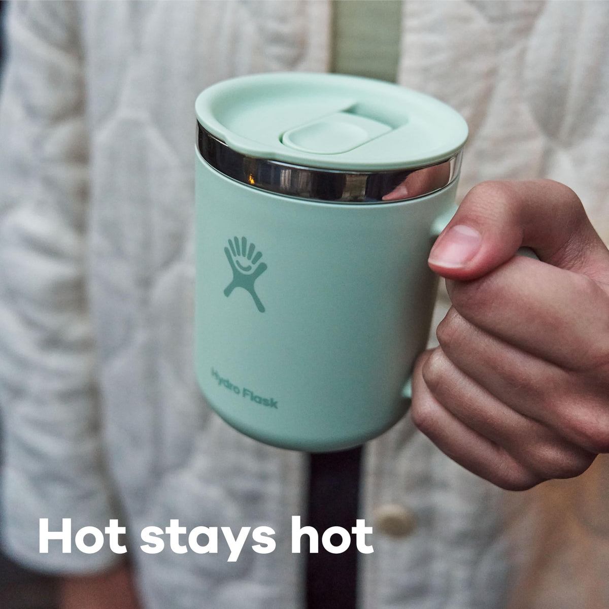 Insulated coffee mug showing handle and soft-touch exterior